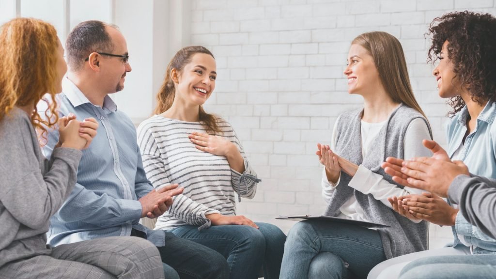 Group counseling encouraging emotional healing and self-esteem in recovery